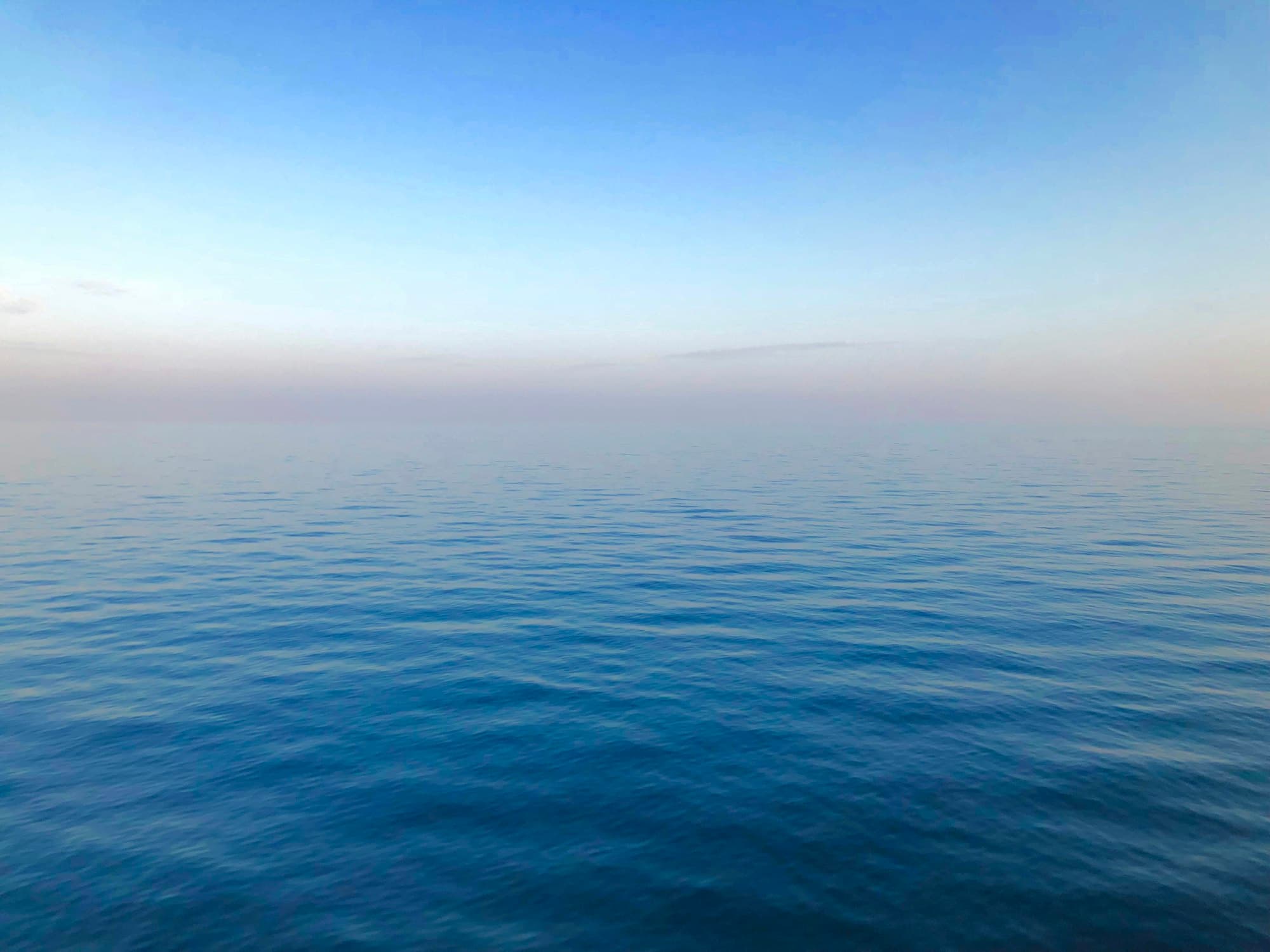Calm blue sea under a clear sky