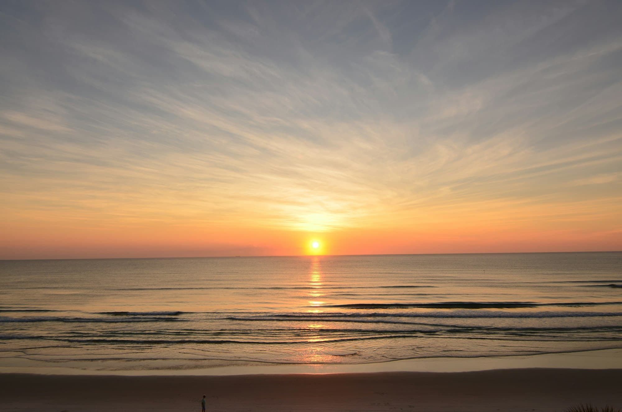 Warm sunset over a calm ocean horizon